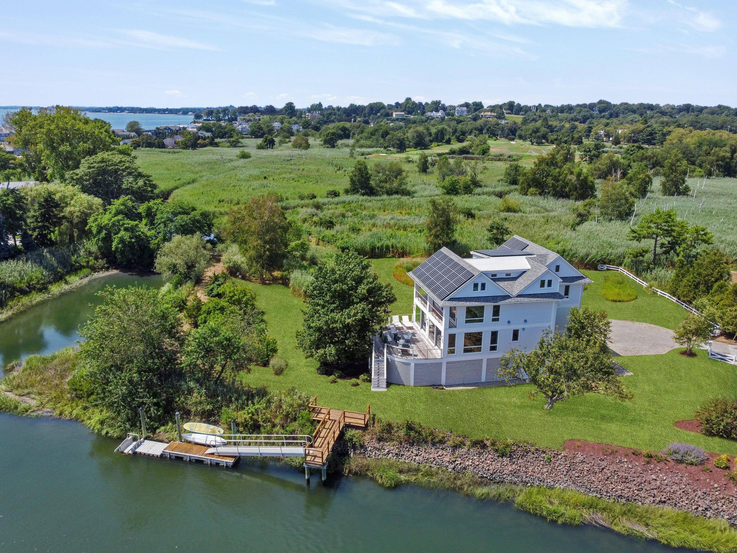 Extraordinary waterfront sanctuary offering unmatched privacy and expansive 1.