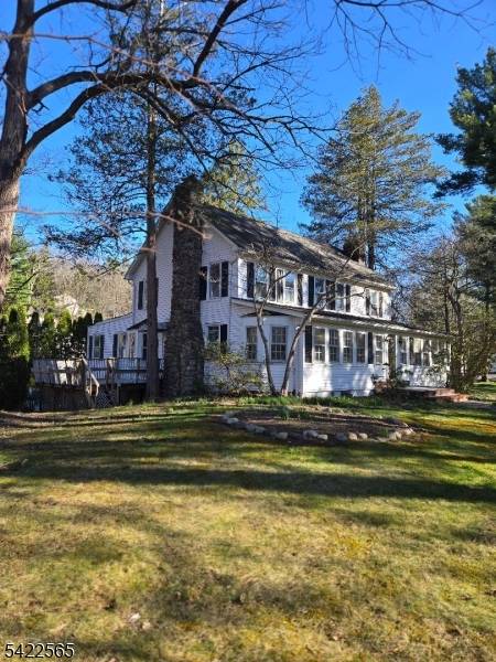 This beautiful corner property home is not a drive by, much larger than it appears, 1 stone fireplace in living room, kitchen, dining room, den with wood burning stove, laundry ...