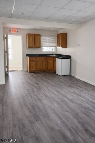 EXCEPTIONAL INCOME PRODUCING OPPORTUNITYVersatile commercial property featuring 3 office spaces and 3 garage warehouse units with overhead doors and loading dock, plus a large usable yard.