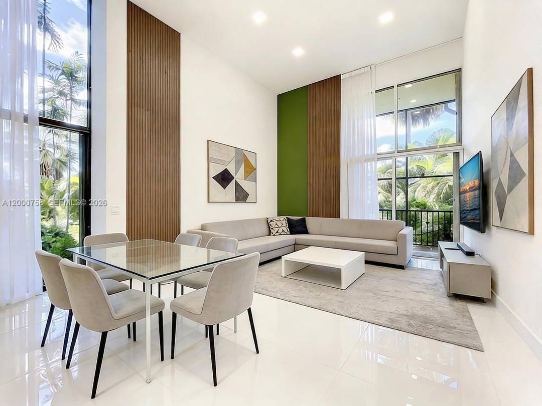 Fully renovated corner townhouse on Aventura Golf Course.