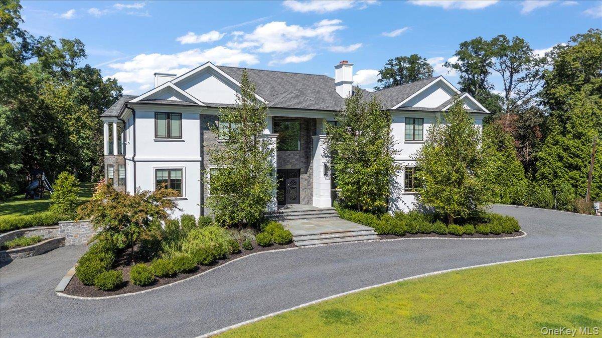 Welcome to 5 Gerry Lane, an extraordinary new construction in the prestigious Village of Lloyd Harbor.