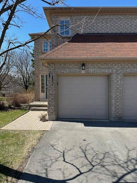 Discover this stunning end unit townhouse nestled in a sought after community, backing onto serene greenspace for ultimate privacy.