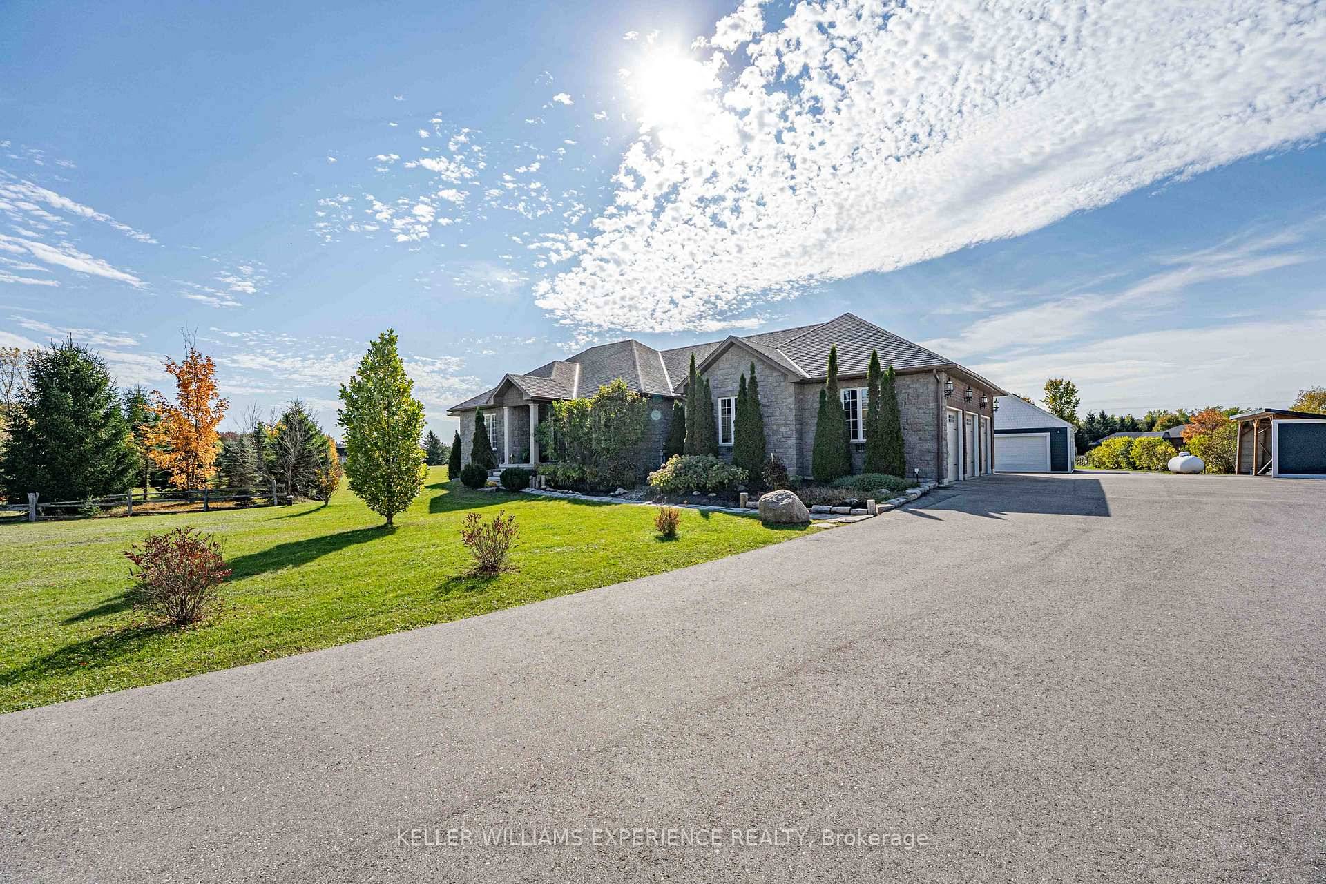 This stunning executive ranch bungalow offers the perfect blend of luxury, space, and functionality set on a peaceful 2.