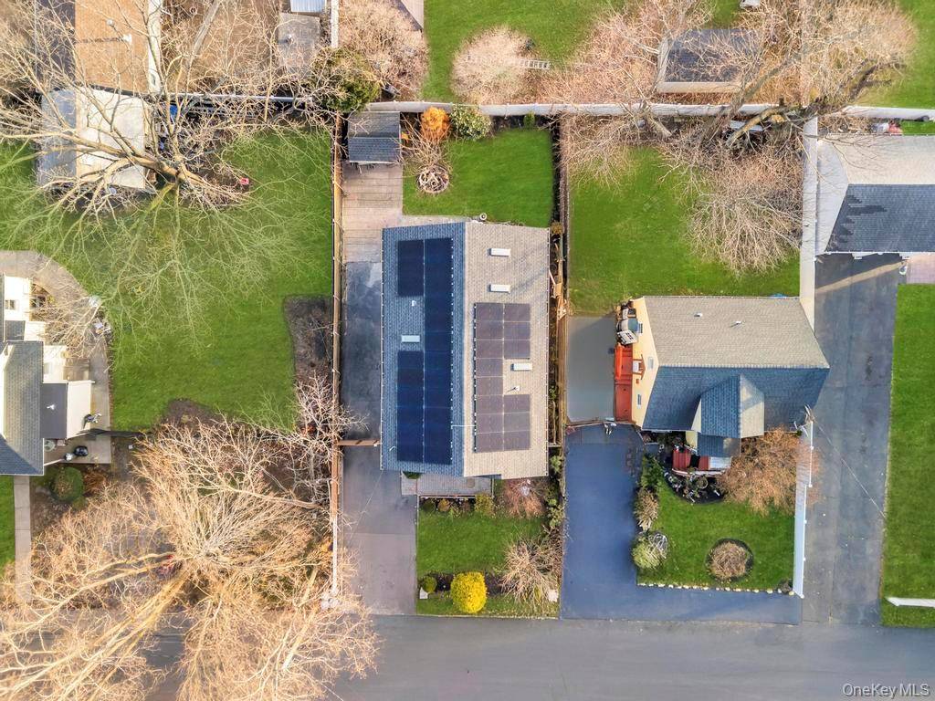 Welcome to this beautiful and expanded 2005 Colonial residence perfectly situated in the heart of Huntington Station.