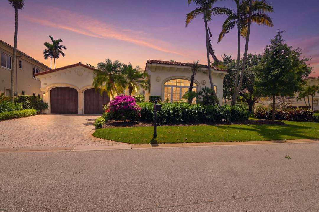 Welcome to 11202 Orange Hibiscus Lane in Old Palm, where refined design meets effortless coastal living within a club known for superb golf and an exceptional social lifestyle.