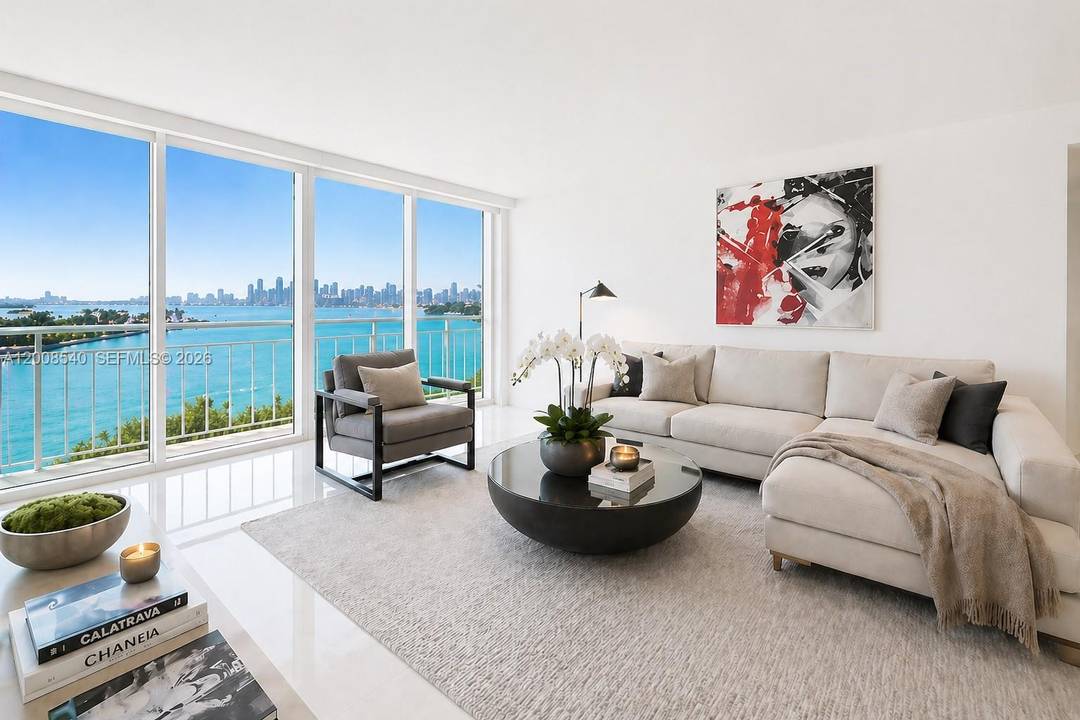 Completely remodeled high floor split floor plan 2 bedroom 2 bath with rare extended balcony with floor to ceiling glass impact windows and doors.