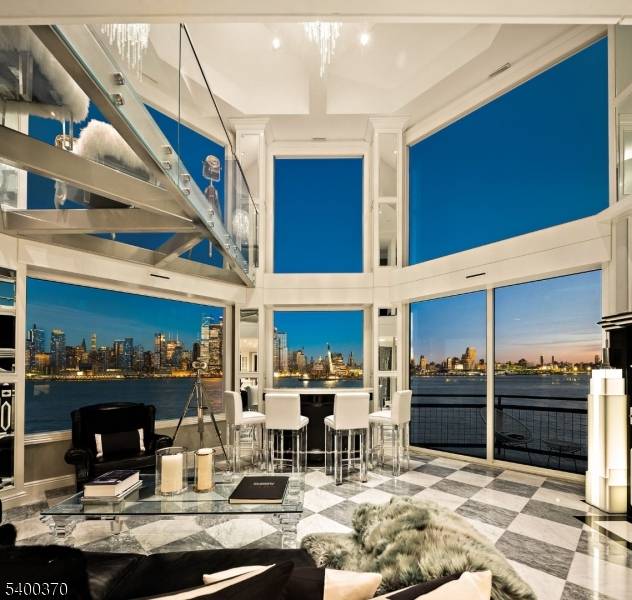 Stunning 2 story penthouse in the sky with breathtaking panoramic NYC Hudson River views !