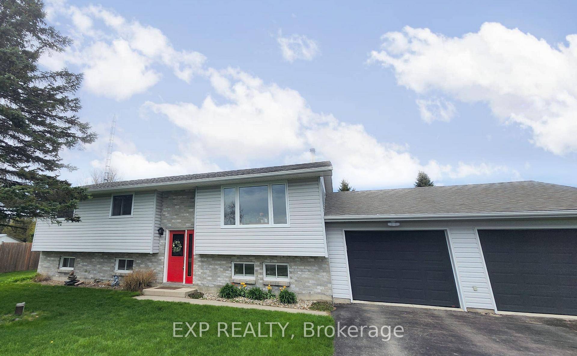 Five minutes from Prescott, this raised ranch bungalow pairs bright open living spaces with a deep backyard that is perfect for summer barbecues and kids at play.
