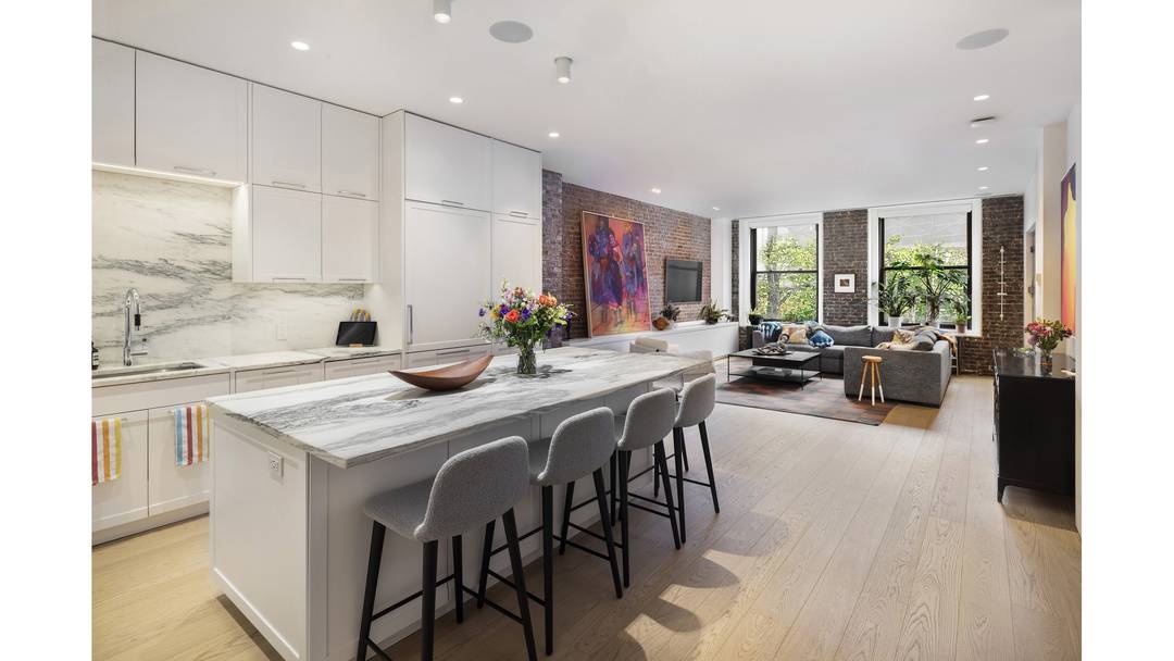 Residence 3W at 28 East 4th Street is a beautifully designed two bedroom loft that seamlessly blends downtown character with modern luxury.