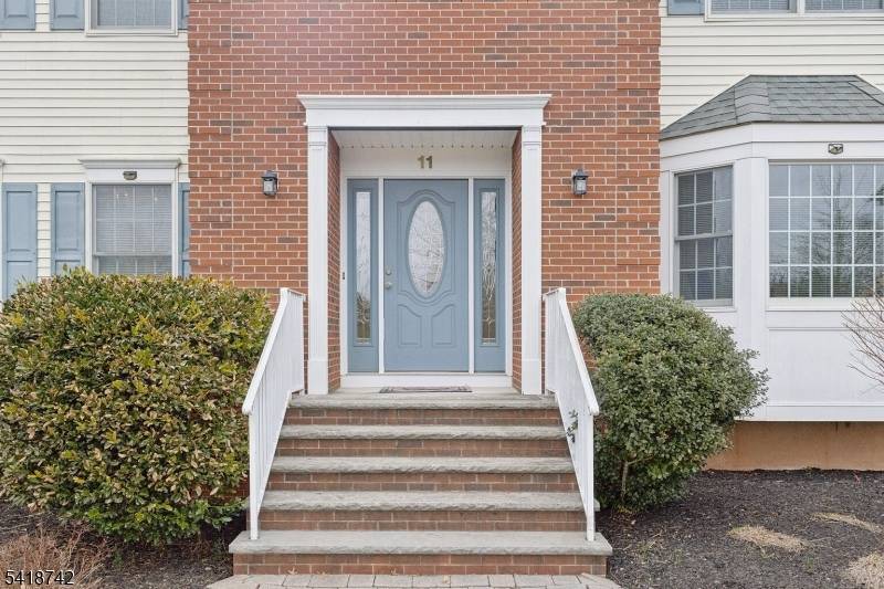 A warm embrace best describes this stunning brick front Colonial, where a paver walkway leads to front door opening into a grand two story foyer ; to the left, a ...