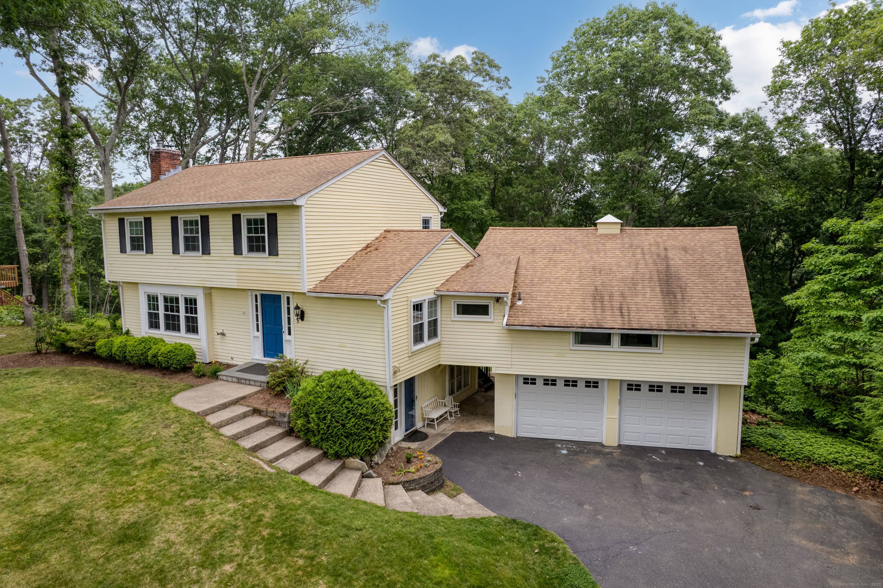 Move in ready Colonial retreat with updated systems and stunning deck overlooking woodlands walk to water trails !