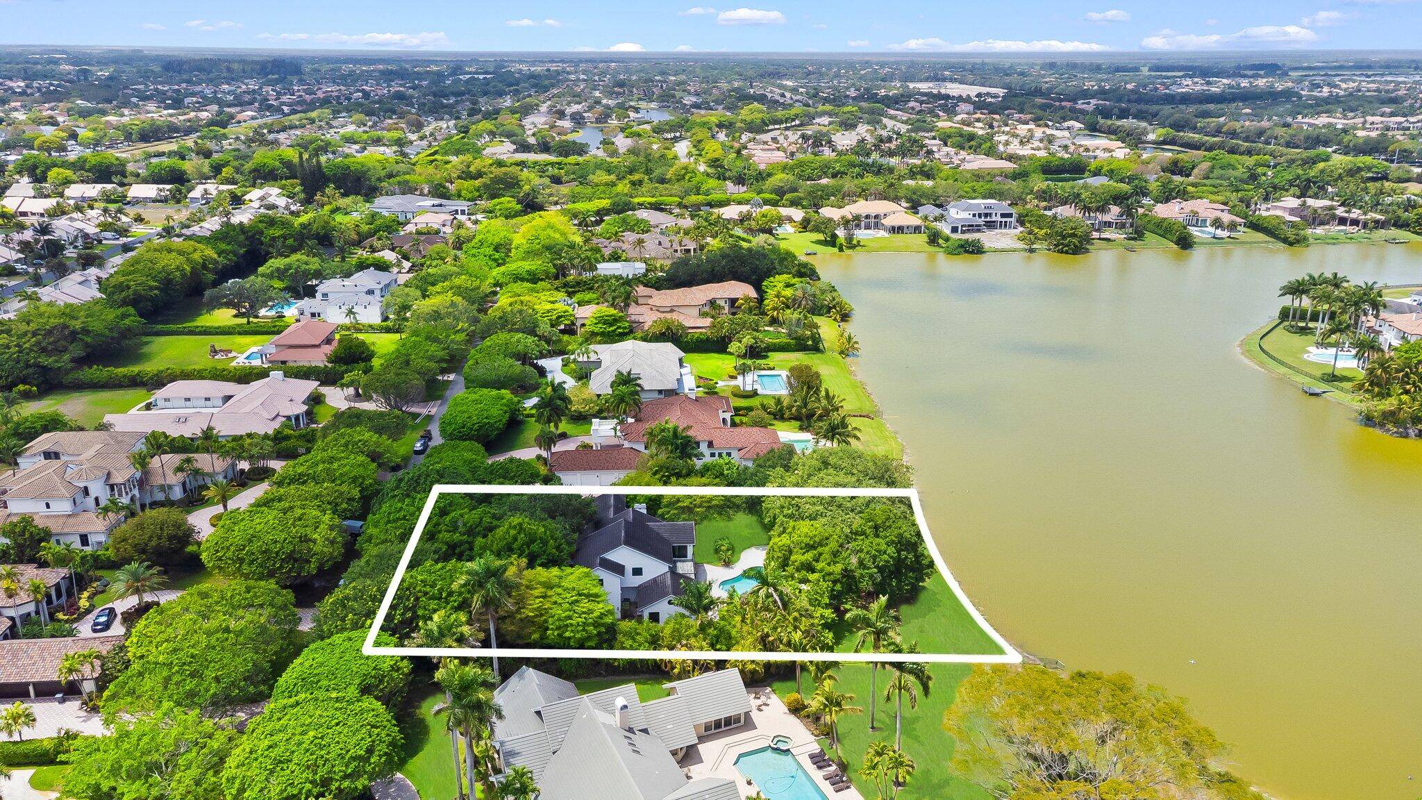 Welcome to 18425 Long Lake Drive in the exclusive gated community of Long Lake Estates in Boca Raton.