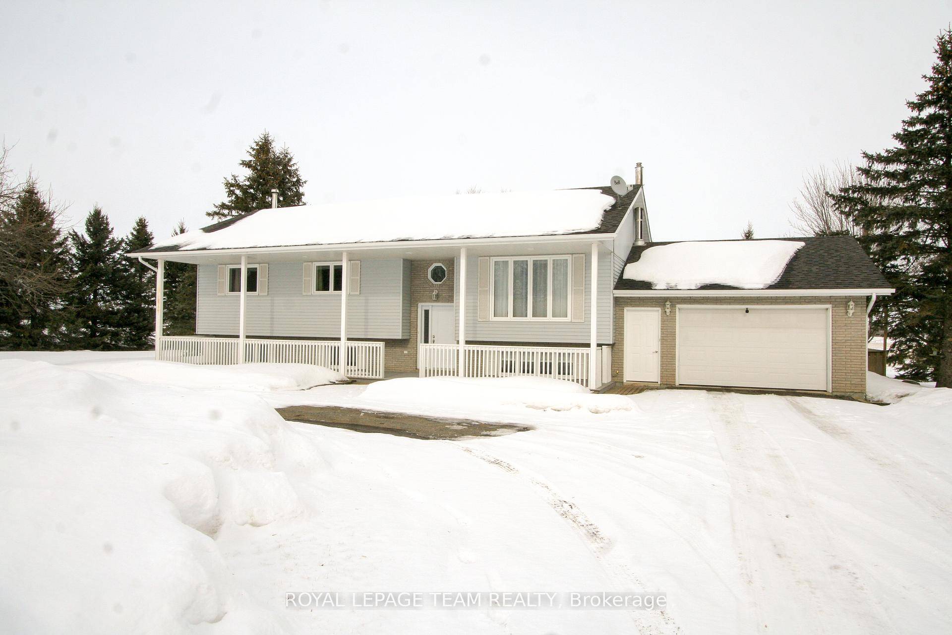 True pride in ownership in this 3 bedroom 2 bath hi ranch bungalow and a detached shop sitting on 12 acres of peace and quiet !