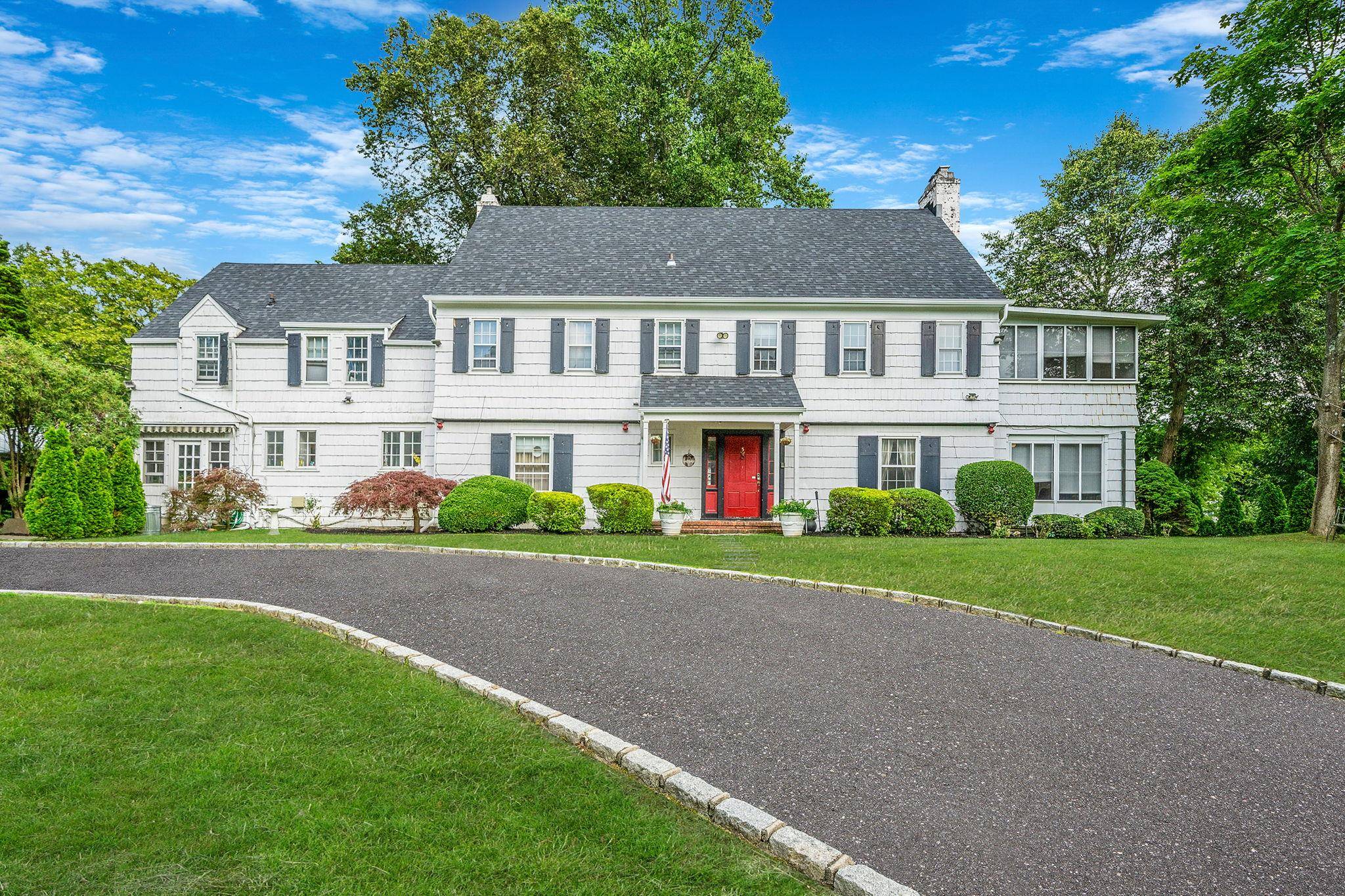 Step into timeless elegance at 5 Kohlsaat Court One of the Historic homes in Smithtown, Built in the 1930s and owned by The Kohlsaat Family a majestic Colonial estate nestled ...