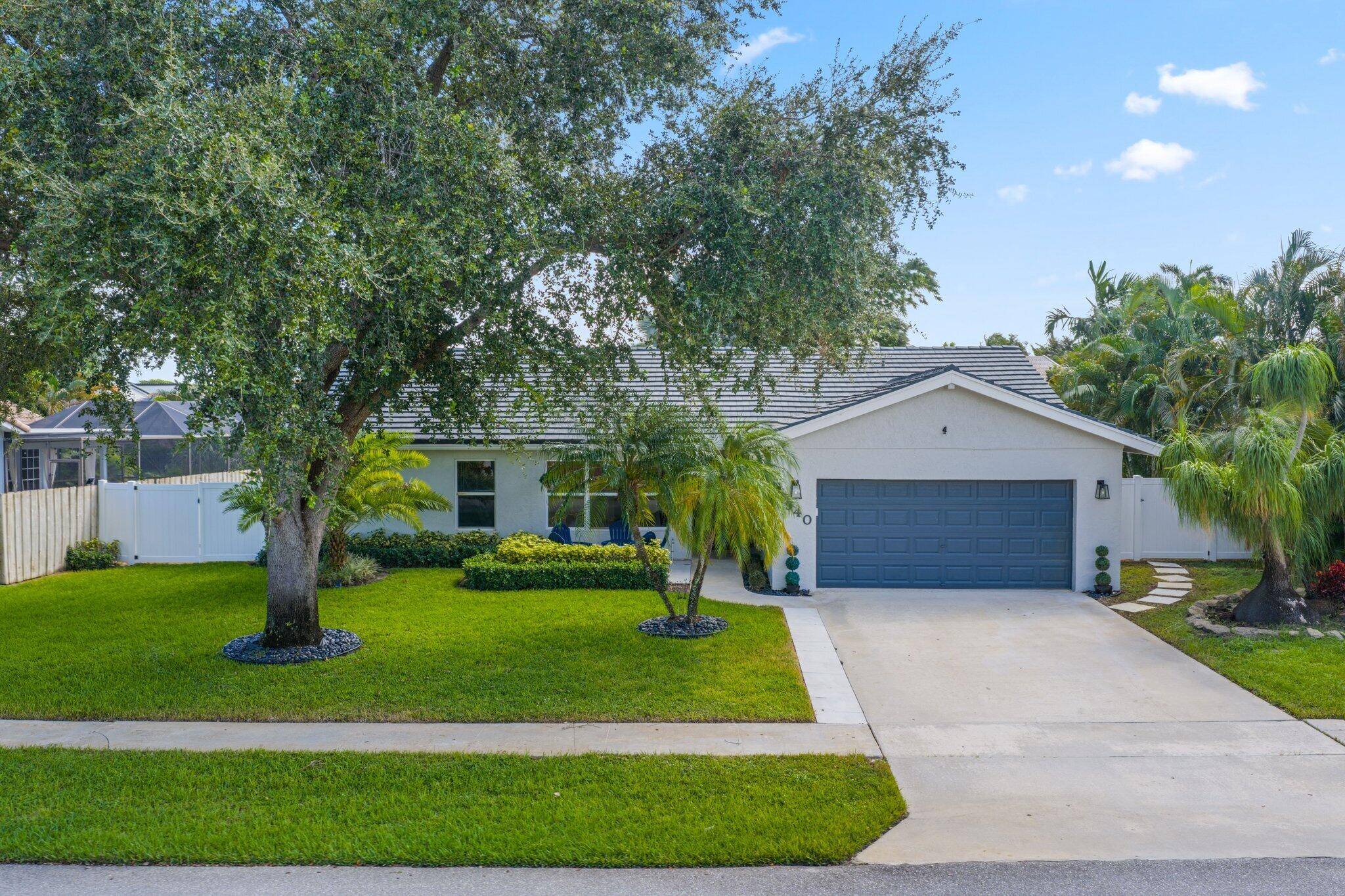 Beautifully renovated 2BR Den home with fenced yard and brand new seawall, serene canal views, full impact windows doors, and roof 10 yrs old.