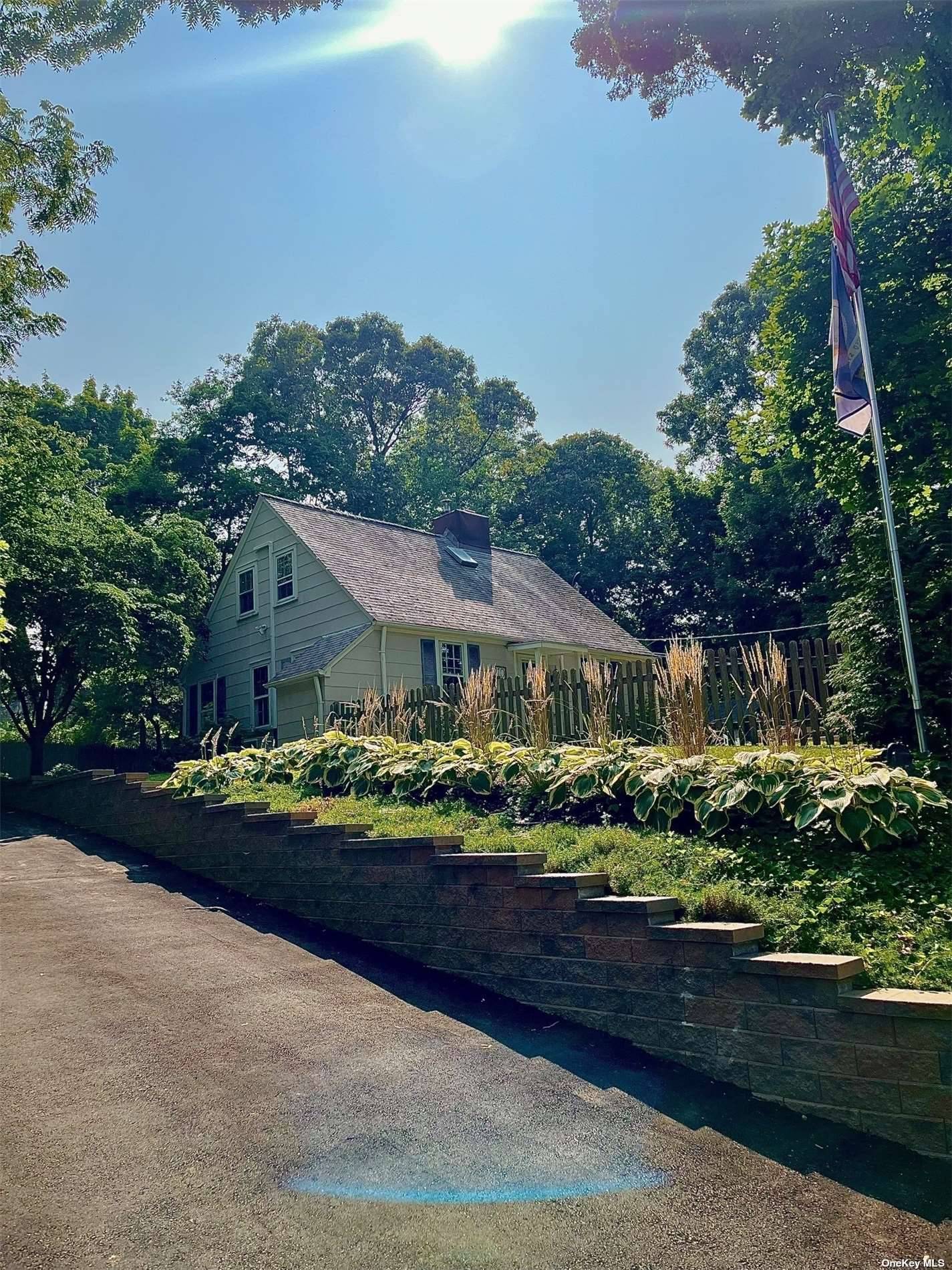 Welcome to your very private cape cod home in desirable Smithtown village.