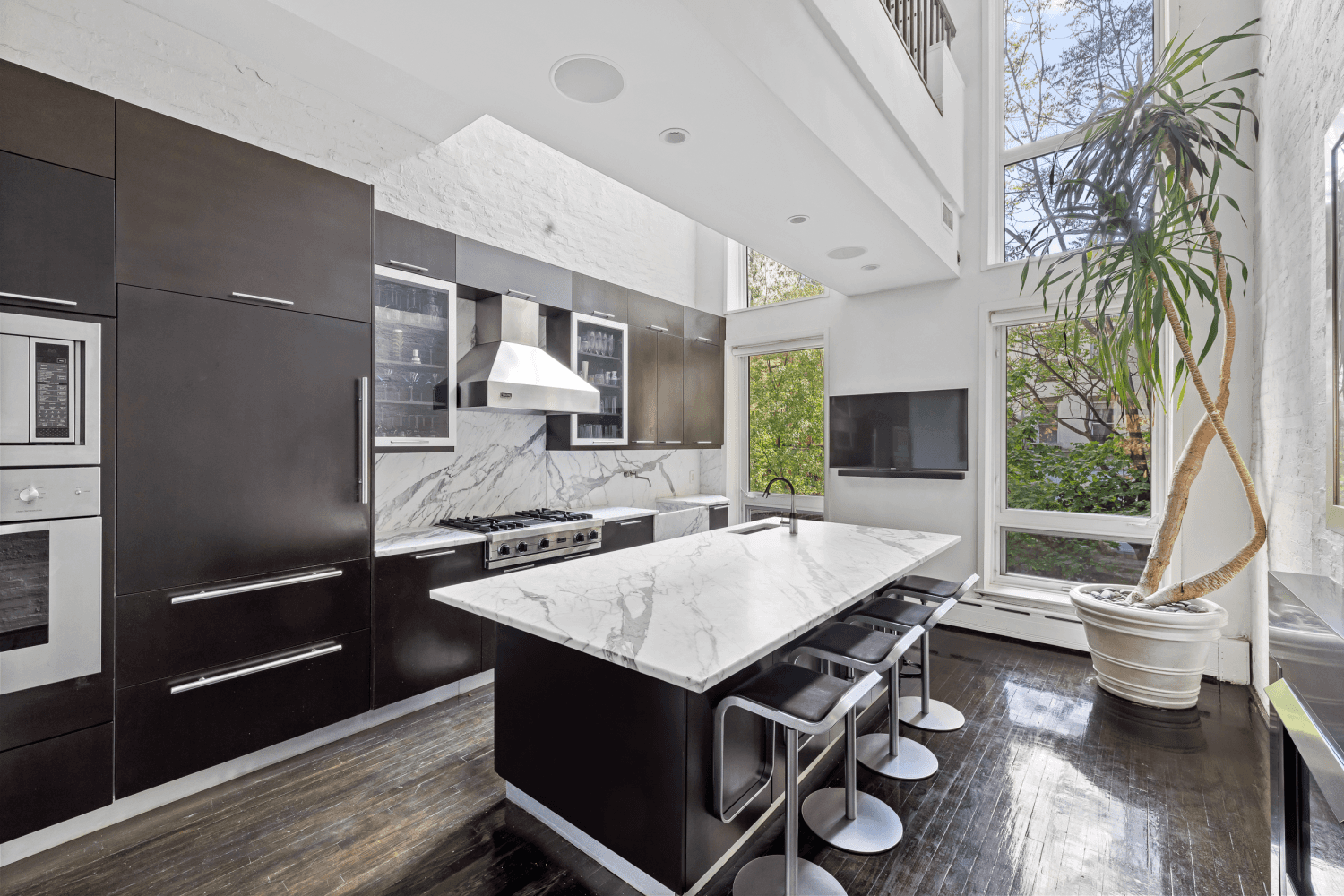 In the heart of Chelsea's vibrant gallery district, where the High Line meets the iconic Hotel Chelsea, an extraordinary townhouse opportunity emerges.