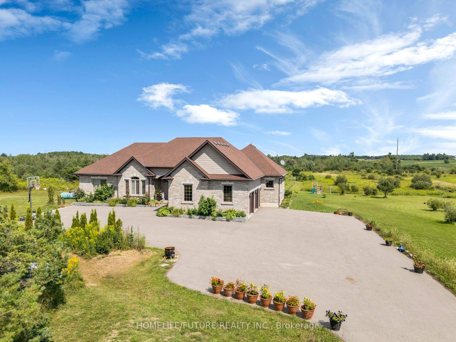 Experience the perfect blend of luxury and country living in this stunning all stone bungalow with a walk out basement and expansive backyard deck, set on a picturesque 40 acre ...