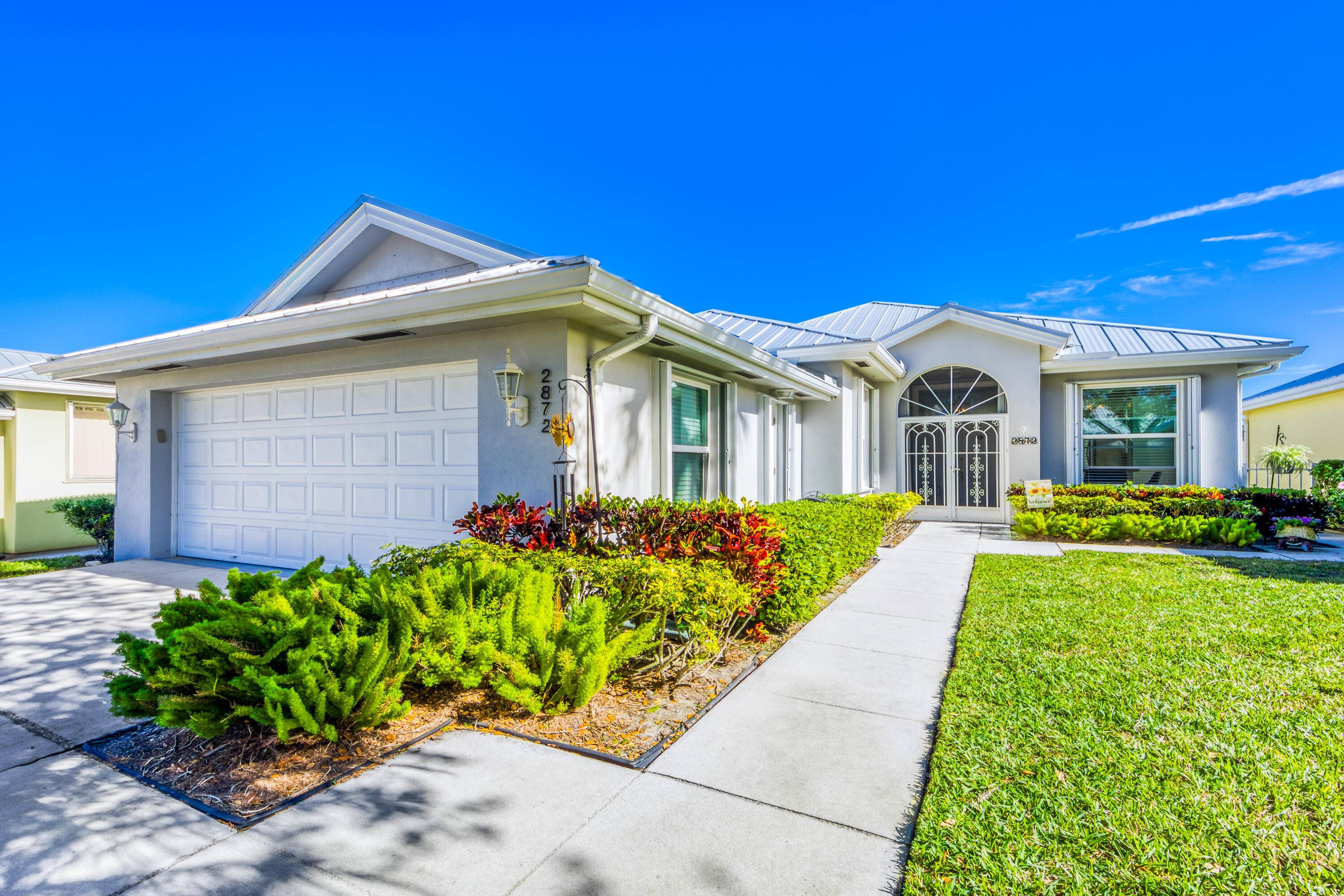 Stunning Hampton Home with wide lake views, in the Beautiful Meadows Community !