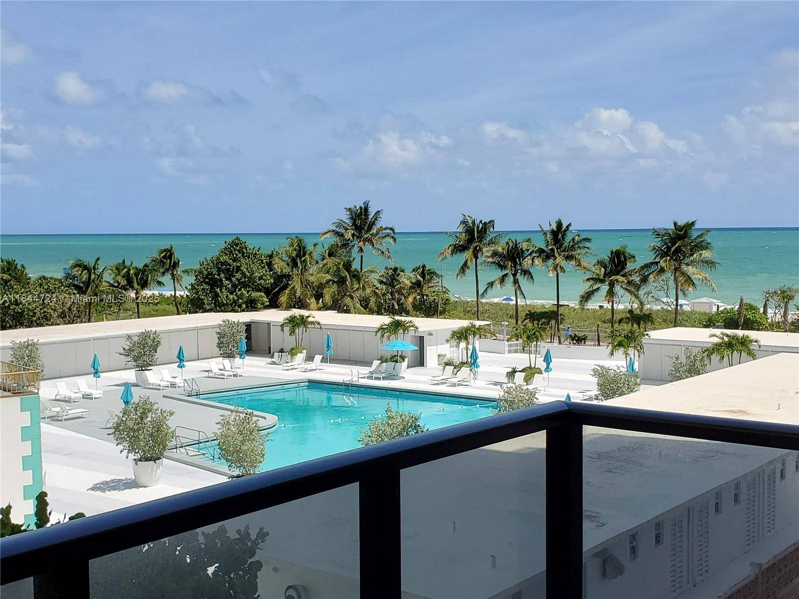 Beautiful 2 bed 2 bath at The Alexander, fully renovated with marble floors, modern kitchen, updated baths, and ocean view balcony.