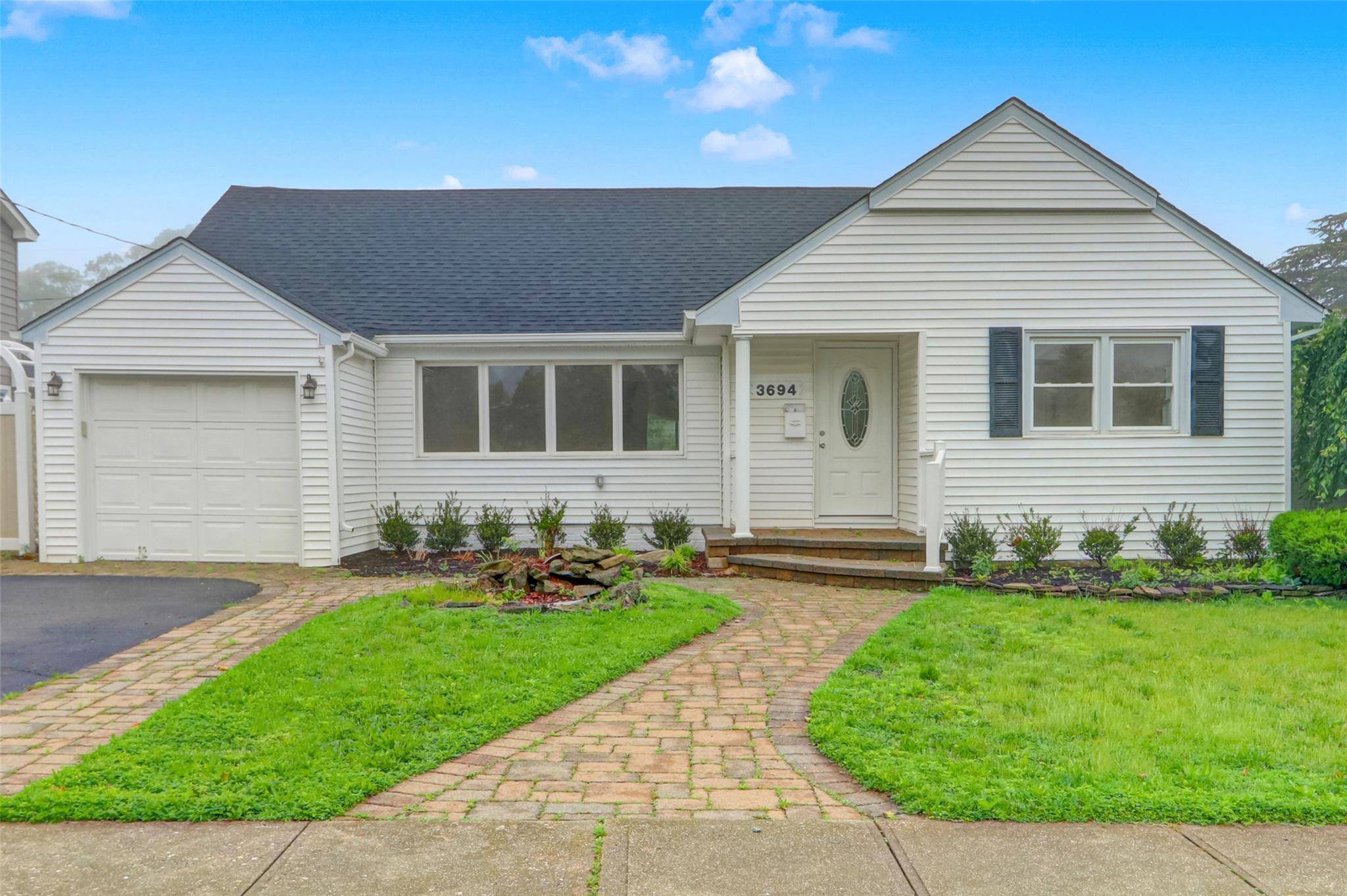 Move right into this renovated, 4 bedroom, 2 bathroom, Expanded, Ranch Style home, with full basement, 1 car garage, in Wantagh.