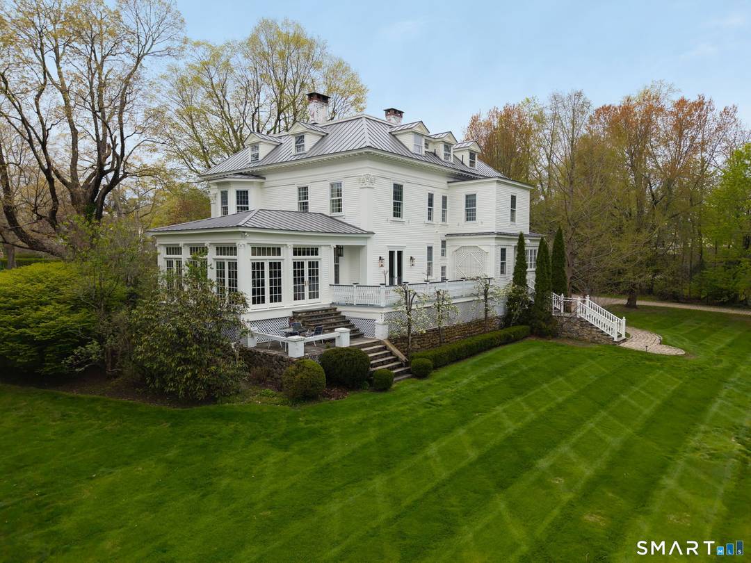 This stunning 1874 Federal house sits on a 3.