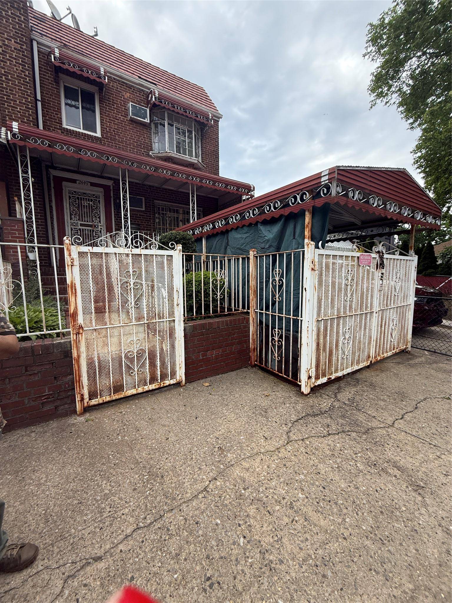 DISCOVER THIS CHARMING BRICK ATTACHED HOME LOCATED IN ONE OF THE MOST UP AND COMING neighborhoods in East ELMHURST Queens.
