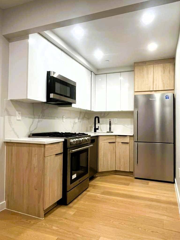 Welcome to Unit 1A, a charming 2 bedroom apartment featuring a private 325sq ft backyard at Garden Lane.