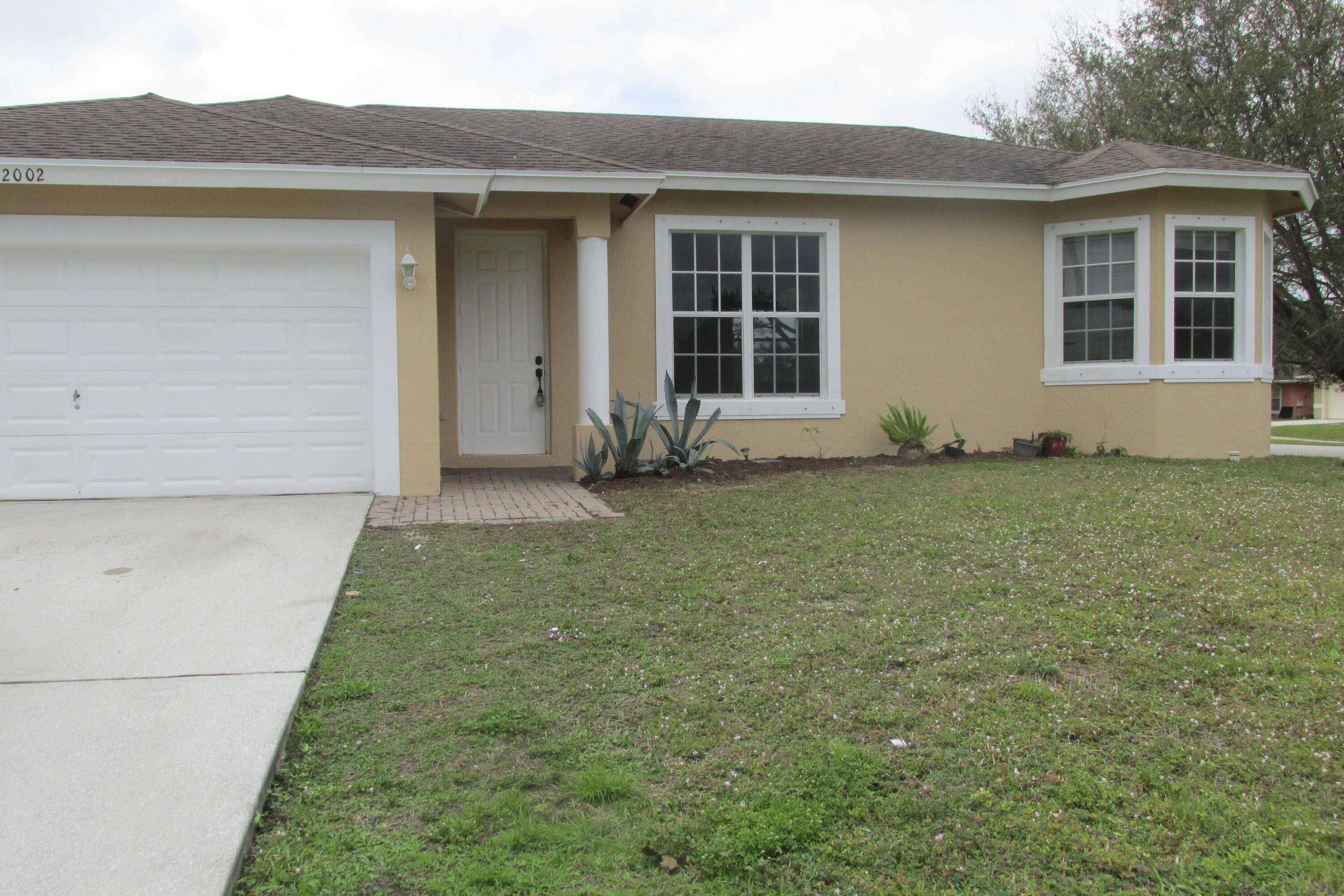 Step into your new home. Wonderful home on a large corner lot, freshly painted exterior, tile flooring throughout main rooms with carpeted bedrooms.