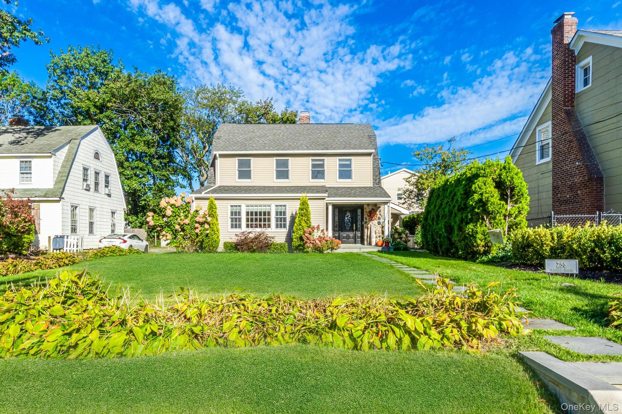 Welcome to 256 Garfield Avenue a beautifully renovated colonial in the heart of Mineola !