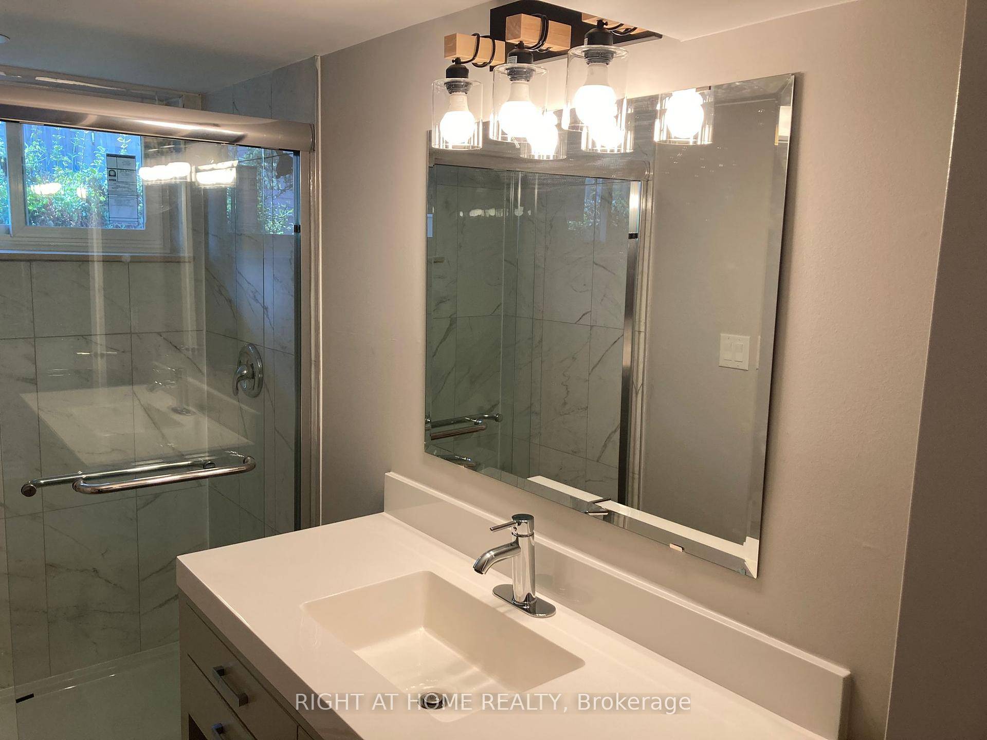 Very spacious and bright newly renovated basement apartment featuring 2 bedrooms, 1 bathroom, and a modern kitchen with brand new cabinets, quartz countertop, dishwasher, microwave.