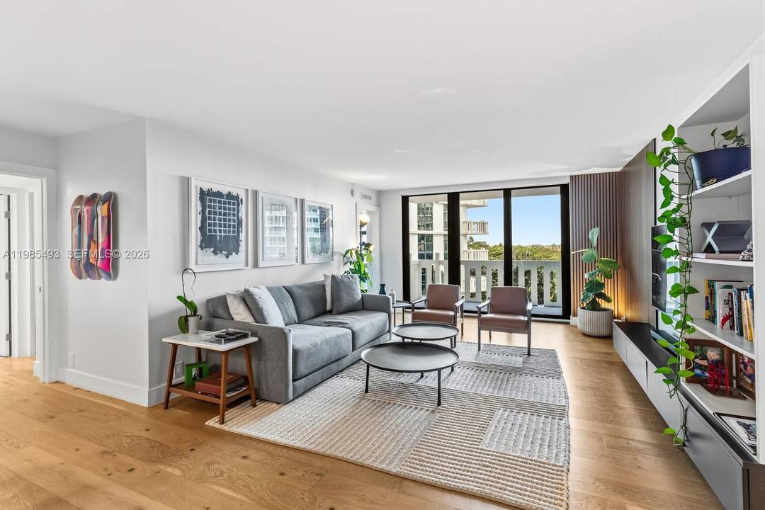 Spectacular fully remodeled residence at Towers of Key Biscayne featuring elegant wood flooring throughout, a sleek modern kitchen, and updated bathrooms.