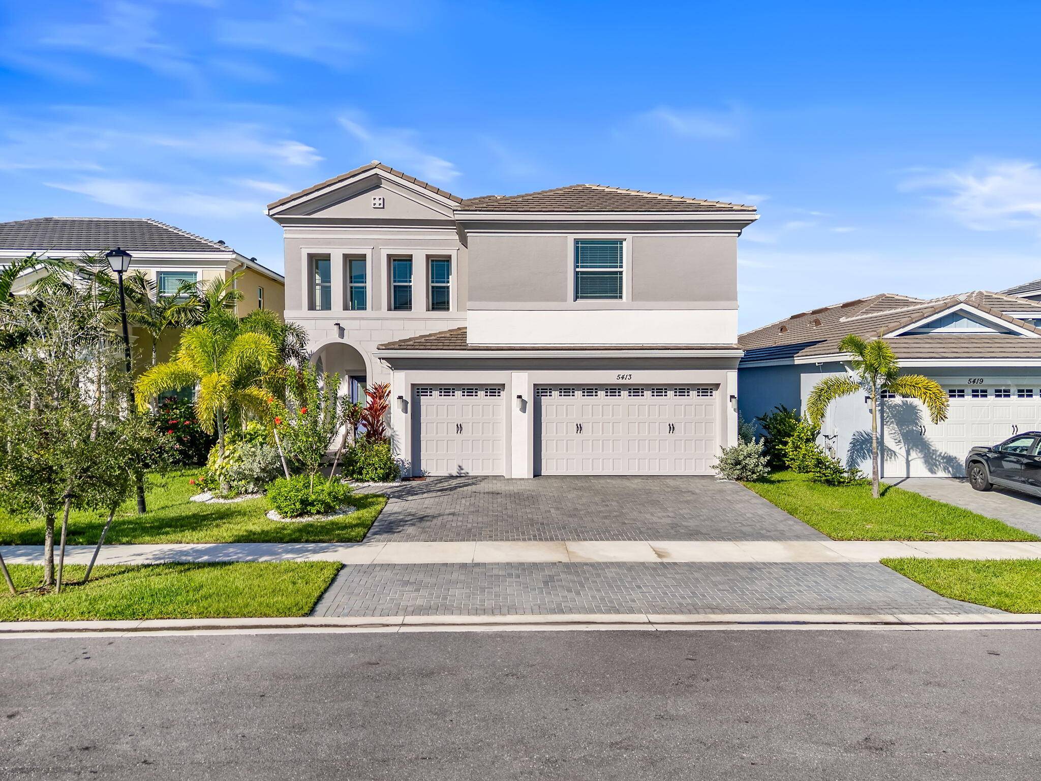 Impressive from the moment you arrive, this home features soaring 20 foot ceilings, impact windows, and extensive upgrades throughout.