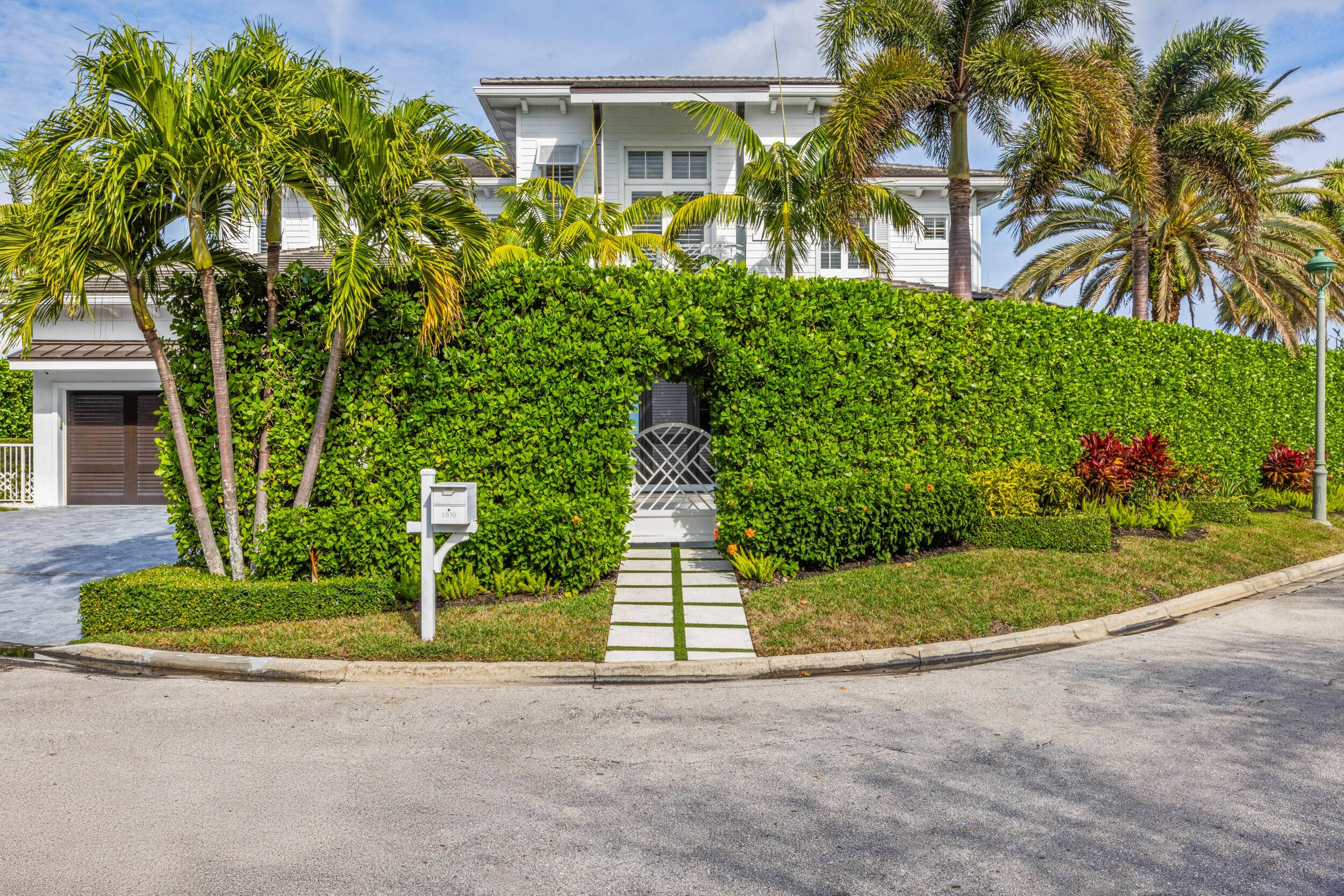Welcome to 1030 Pine Point, a stunning West Indies inspired waterfront estate with breathtaking water views offering timeless elegance and modern sophistication.