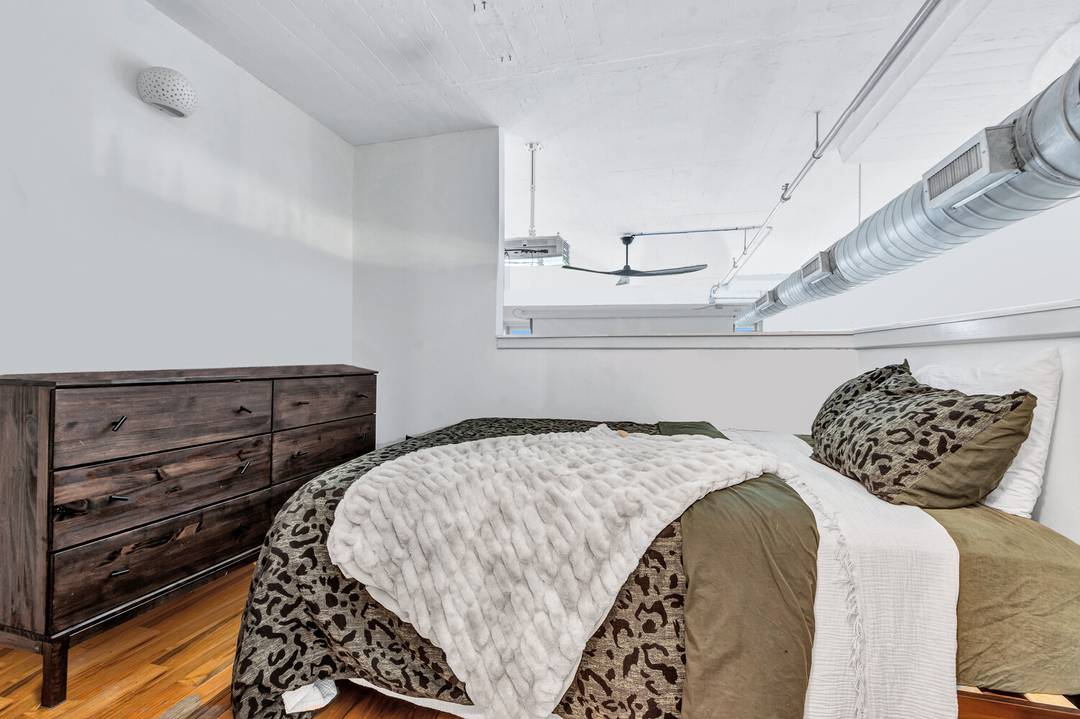 LOFT OF A LIFETIME Experience elevated loft living in this expansive 862 square foot residence with soaring 13 foot ceilings, offering the flexibility of a one bedroom at The Chocolate ...