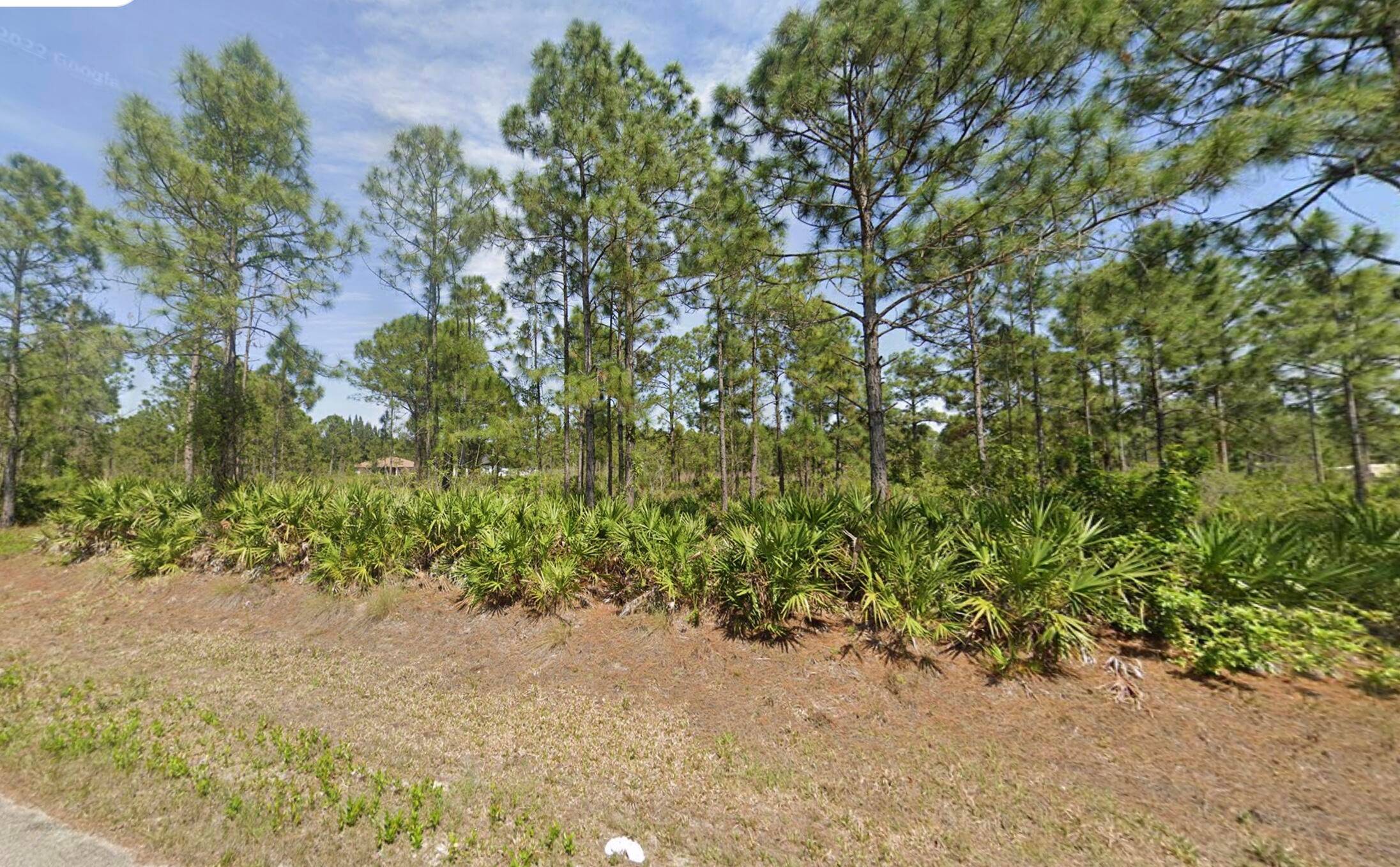 Unlock the potential of this expansive half acre parcel in the heart of Lehigh Acres.