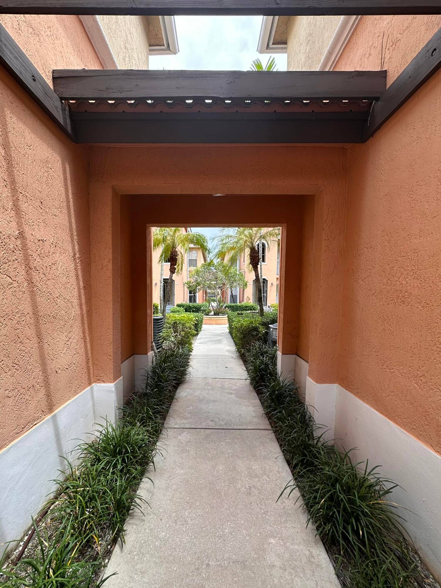 This second floor unit offers a private, gated entrance on the first floor, which includes a convenient storage closet.