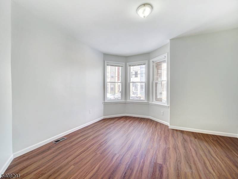 Recently renovated two family home with exceptional income potential and generous living space.