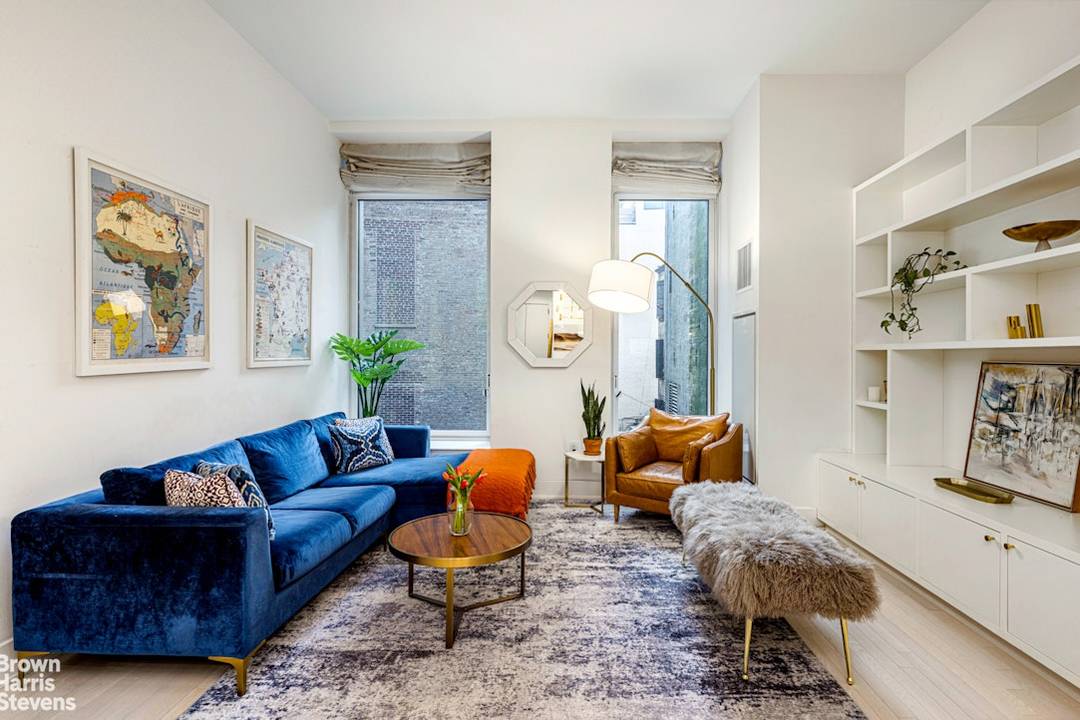 This triple mint corner residence is a refined interpretation of the iconic Tribeca loft aesthetic, featuring slender whitewashed oak plank floors, soaring ceilings, and nearly floor to ceiling windows that ...