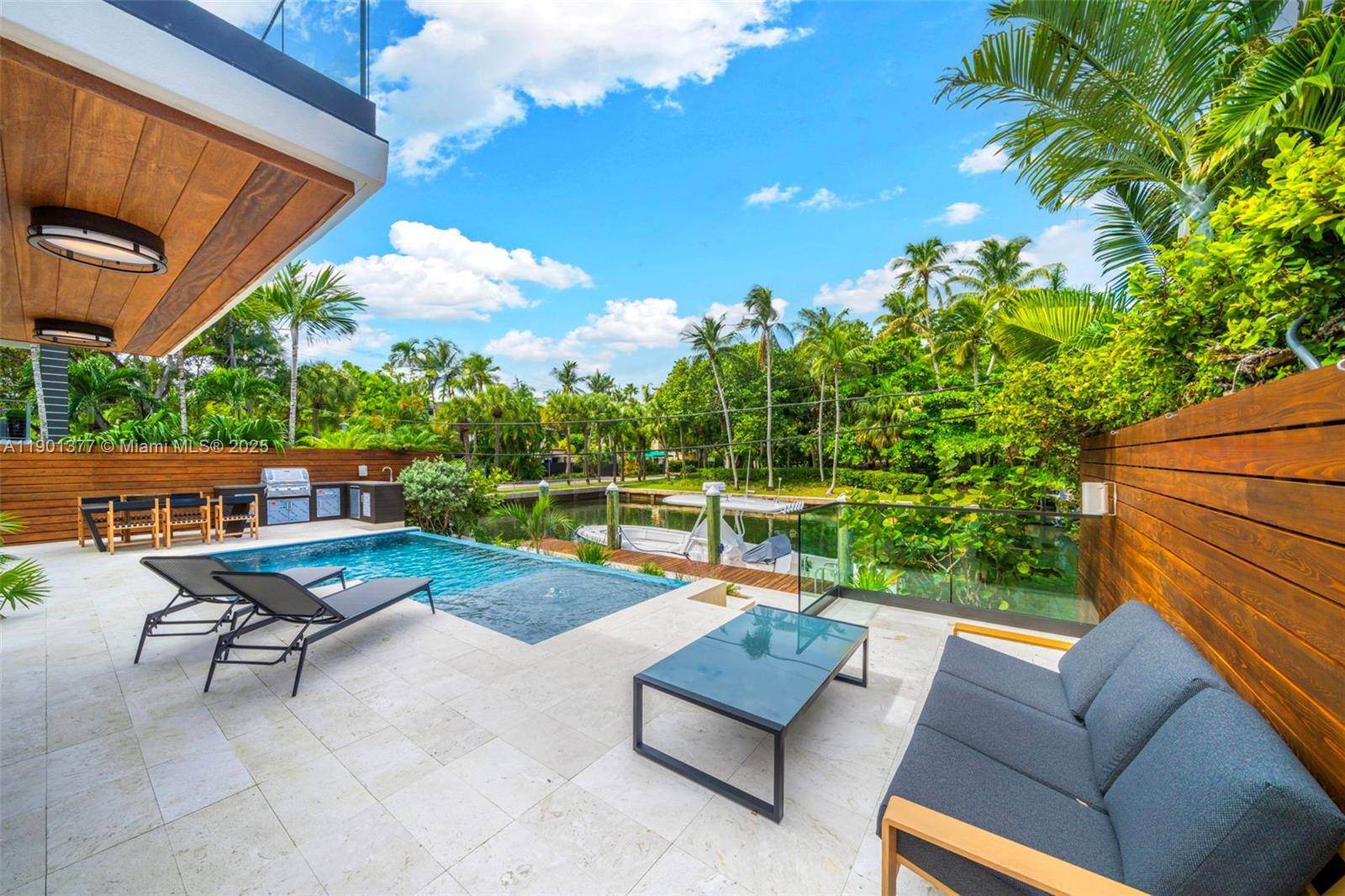 A Modern Boater s Paradise This exceptional waterfront residence in Coconut Grove seamlessly blends architectural elegance with contemporary comfort.