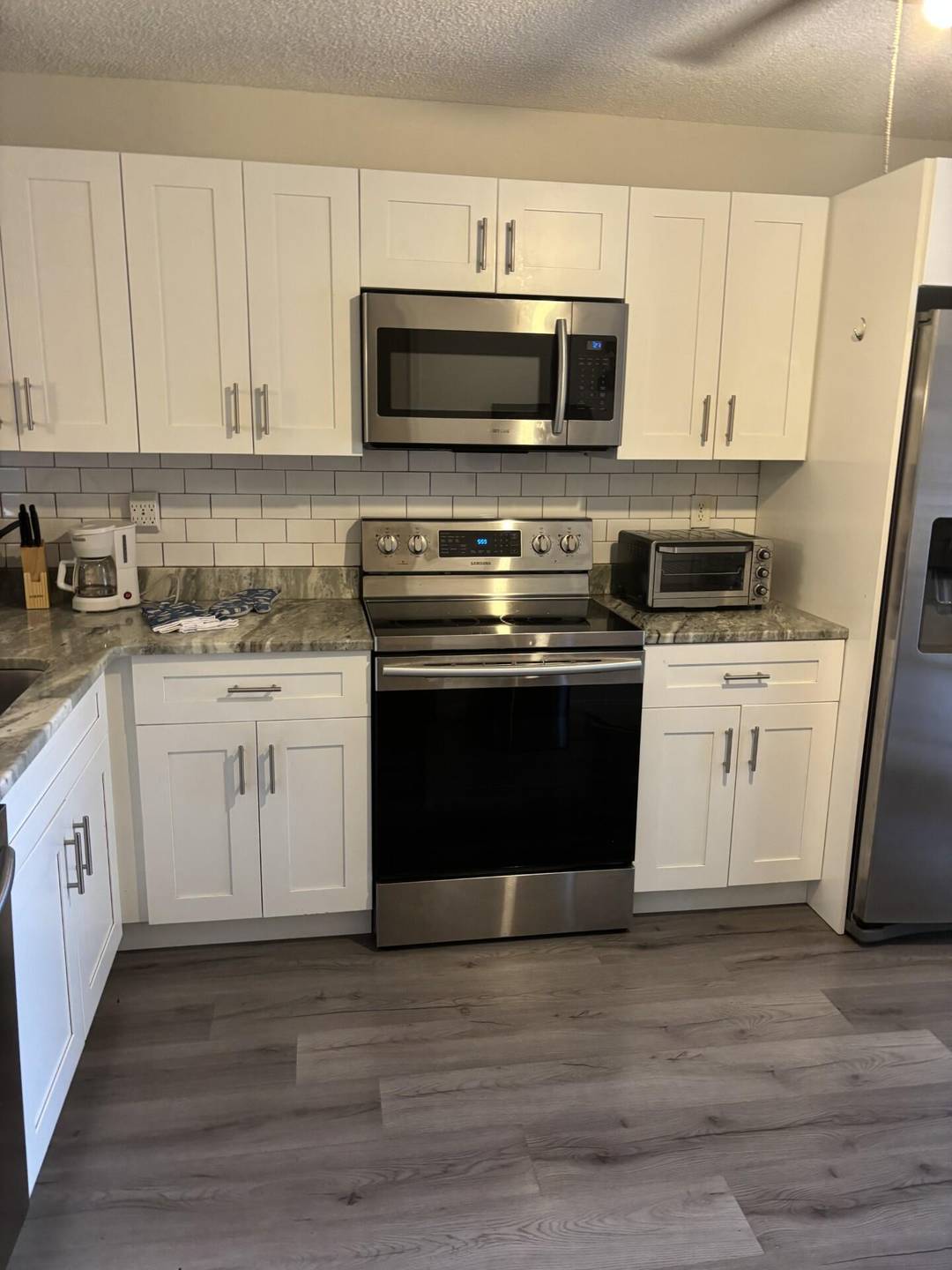 Enjoy relaxed coastal living in this beautifully updated first floor, 2 bedroom waterfront condo located just 2 miles from the beach.