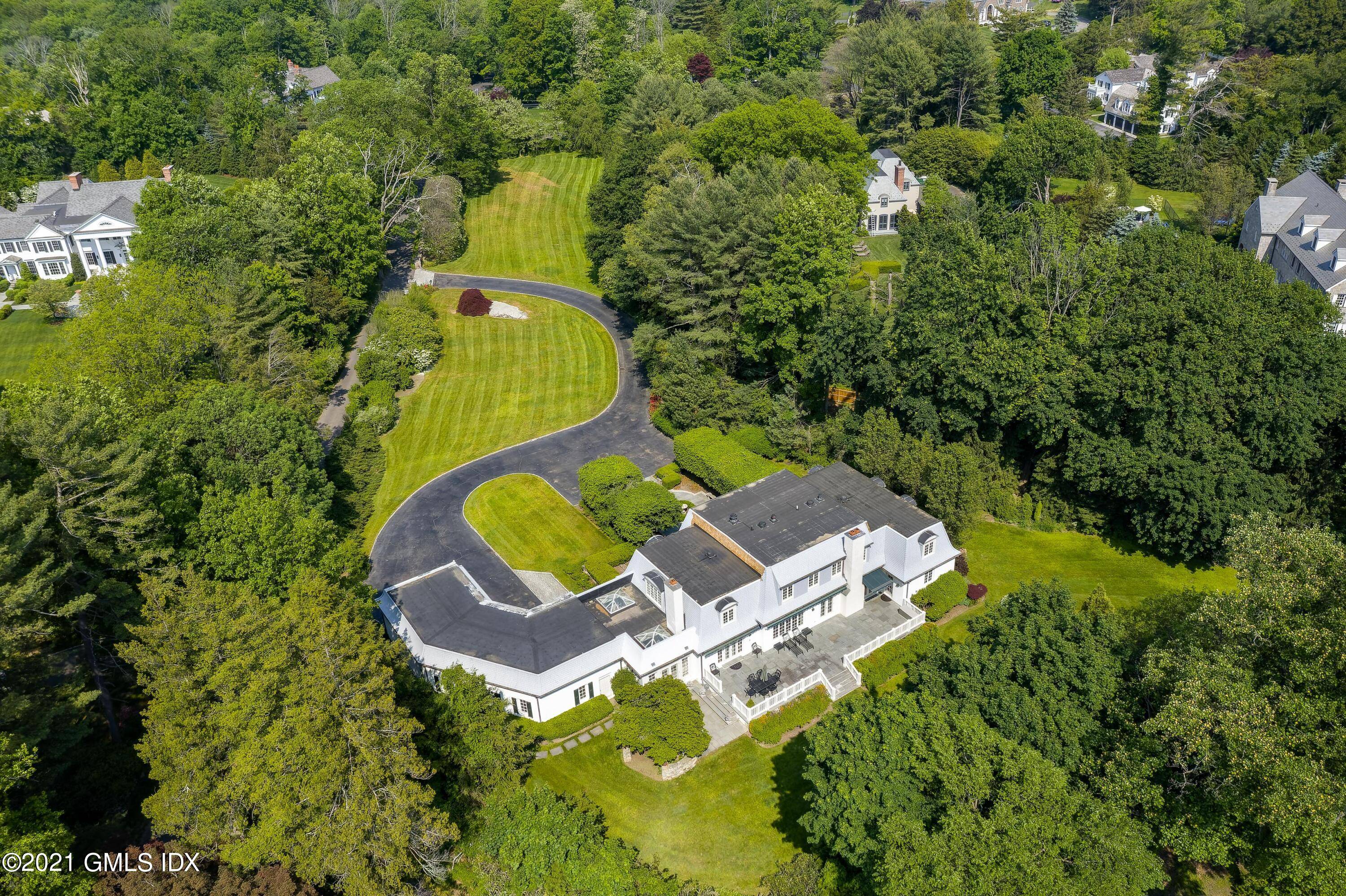 Beautiful setting on a private lane off Round Hill, this handsome colonial has magnificent 2.
