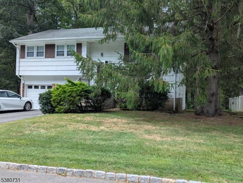Welcome to this well maintained home in a sought after neighborhood, offering a spacious yard, a two car garage, and a double wide driveway perfect for guests or extra parking.