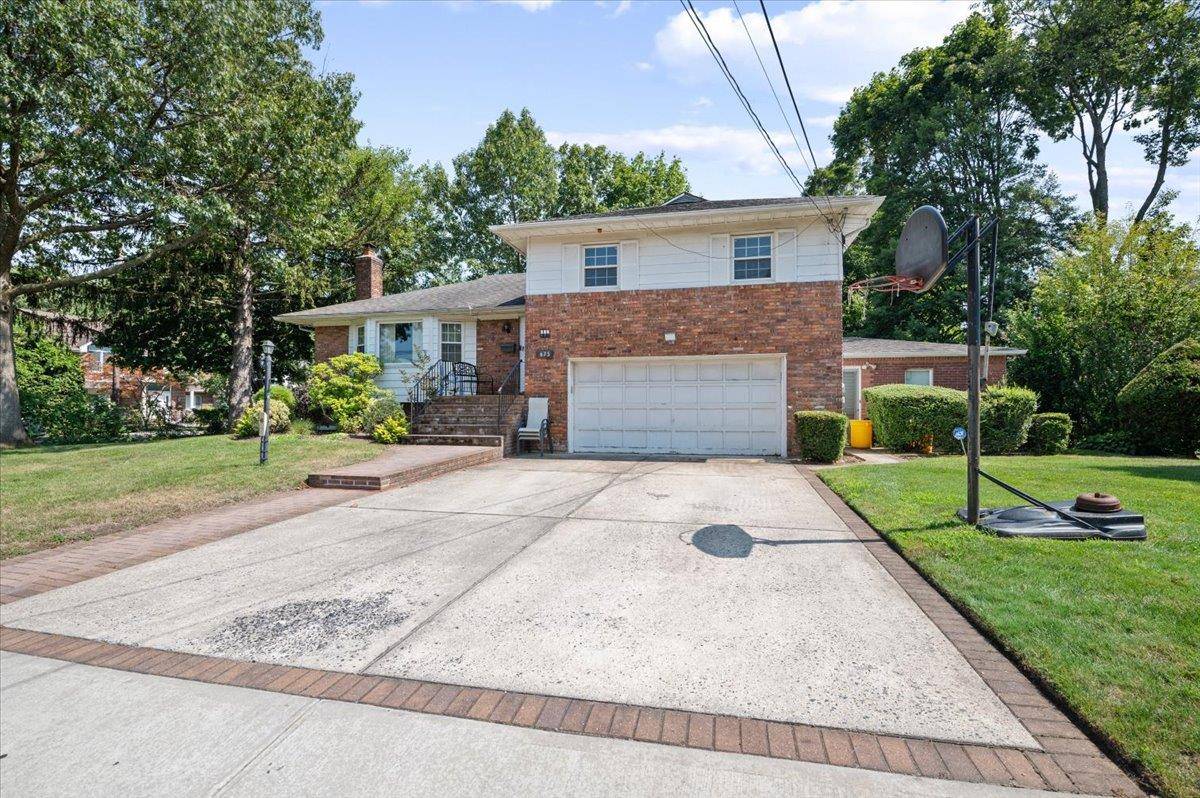 Welcome to 675 Emerson Street Situated on an oversized lot in the sought after ABC streets in Woodmere, this expanded split level home offers five bedrooms, a two car garage, ...