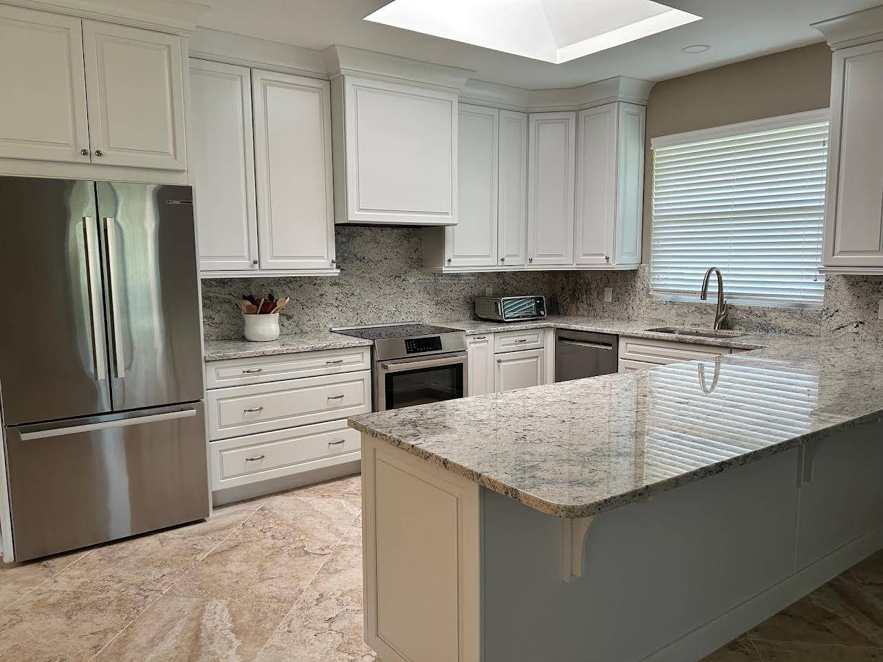 Magnificent recently renovated home located in exclusive PGA Village situated on a 1 2 acre lot.