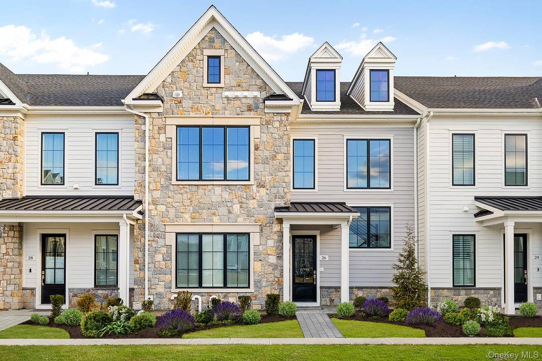 Welcome to 26 Wallace Way a standout residence in the coveted, sold out Chappaqua Crossings Carriages community.