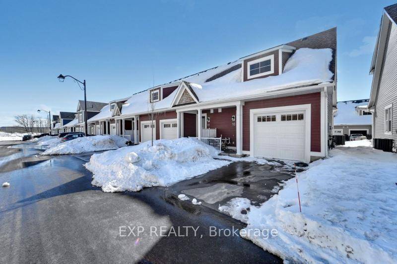 Experience elevated living in this highly upgraded end unit townhome in Seasons on the Lake.