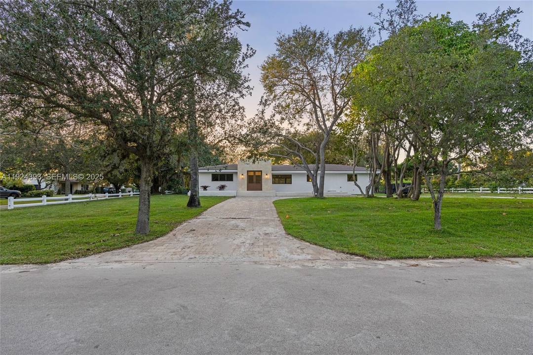 Completely renovated modern estate on an expansive corner lot in desirable Pinecrest.