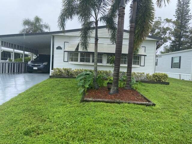 This home is located on a quiet cul de sac with a lake at the end of the street.