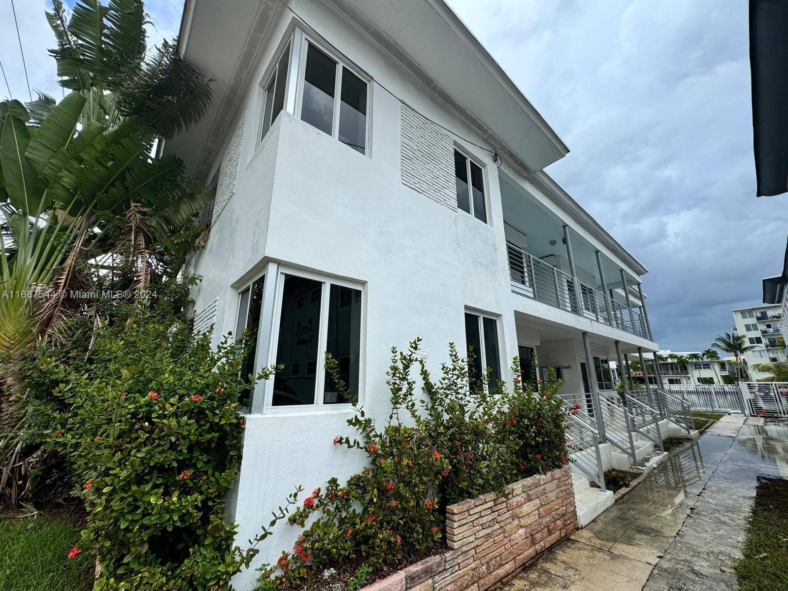 Discover an incredible investment opportunity with this waterfront six unit building, located in a desirable neighborhood just a short stroll from the ocean.